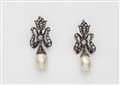 A pair of silver and diamond earrings with large natural pearl drops - image-1