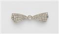 A platinum diamond bow brooch - image-1