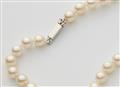 A pearl sautoire with a 14k white gold diamond clasp - image-3