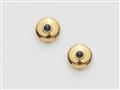 A pair of 18k gold and sapphire button covers - image-1