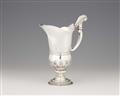 A silver pitcher - image-1