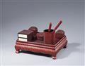 A set of writing objects on a table in the manner of carved red lacquer. 20th century - image-2