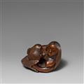 A boxwood netsuke of a nursing ningyo. 19th century - image-1