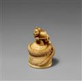 An ivory netsuke of Kiyohime on top of the Dojoji bell. 19th century - image-1