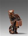 A wood netsuke of a street performer with a weasel. 19th century - image-1