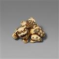 An ivory netsuke of a shishi and a cub. Late 18th century - image-1