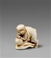 An ivory netsuke of a dog and an octopus. 19th century - image-1