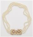 A French cultured pearl necklace with an 18k gold and diamond flower clasp. - image-1