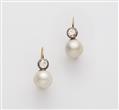 A pair of 18k gold diamond and South Sea cultured pearl earrings. - image-1