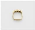 A German 18k gold emerald three stone ring. - image-2