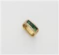 A German 18k gold emerald three stone ring. - image-1