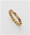 A 14k gold sapphire and diamond bangle. - image-1