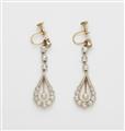 A pair of Belle Epoque 14k gold diamond and pearl pendant earrings. - image-1
