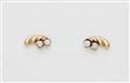 A pair of 18k gold and diamond retro stud earrings. - image-1