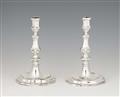 A pair of silver candlesticks - image-1