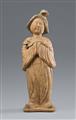 A figure of a court lady with a dog. Tang dynasty (618–907) - image-1