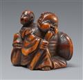 A boxwood netsuke of a mother and child. 19th century - image-1