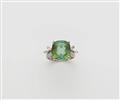 An 18k gold diamond and green tourmaline ring. - image-1