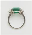 A Columbian platinum emerald and diamond three stone ring. - image-2