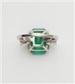 A Columbian platinum emerald and diamond three stone ring. - image-3
