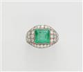 A platinum diamond and carré-cut emerald ring. - image-1