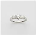 A platinum diamond solitaire ring. - image-1