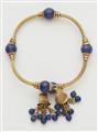 An archeological revival 18k gold and lapis lazuli bangle with tassels. - image-2