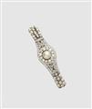 A French platinum diamond and pearl buckle bracelet with later velvet strap. - image-1