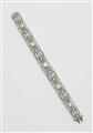 An Art Déco platinum diamond and emerald bracelet. - image-1