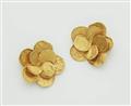 A pair of 14k gold floral clip earrings. - image-1