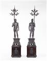 Two bronze figures of warriors holding candelabra - image-1