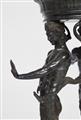 A patinated bronze tripod with three male figures - image-4