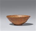 An oval-shaped aka raku chawan. Kyoto. 18th century - image-1