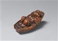 A boxwood netsuke of Hotei resting in a boat. Late 19th century - image-1