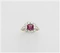 An 18k white gold diamond and Burma ruby cluster ring. - image-1