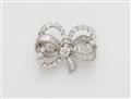 A French 18k gold platinum and diamond bow brooch. - image-1
