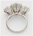 An American 14k white gold and diamond three stone ring. - image-2