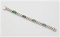 A Rhodium plated 18k yellow gold sapphire and emerald chain bracelet. - image-1
