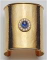 A custom made 18k yellow gold diamond and Ceylon sapphire cabochon cuff bracelet. - image-2