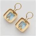 A pair of 18k gold and step-cut aquamarine clip earrings. - image-2