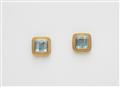 A pair of 18k gold and step-cut aquamarine clip earrings. - image-1