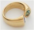 A Belgian 18k gold tanzanite and green tourmaline toi-et-moi ring. - image-2
