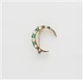 A 14k gold diamond and emerald crescent moon brooch. - image-1