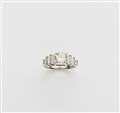 A German 14 kt white gold and c. 1.27 ct diamond solitaire Art Déco ring. - image-1