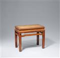 An oblong hardwood stool with a cane seat. Late Qing dynasty - image-1
