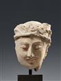 A Gandhara stucco head of a bodhisattva. Pakistan/Afghanistan. 2nd/3rd century - image-1