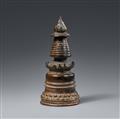 A Tibetan black patinated bronze kadampa-stupa - image-1