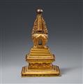 A Tibetan fire-gilt bronze bumpa-stupa. 18th century or later - image-1