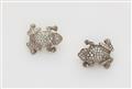 A pair of14k white gold, silver and diamond frog brooches. - image-1