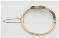 A platinum 18kt gold and diamond Belle Epoque bangle. - image-2